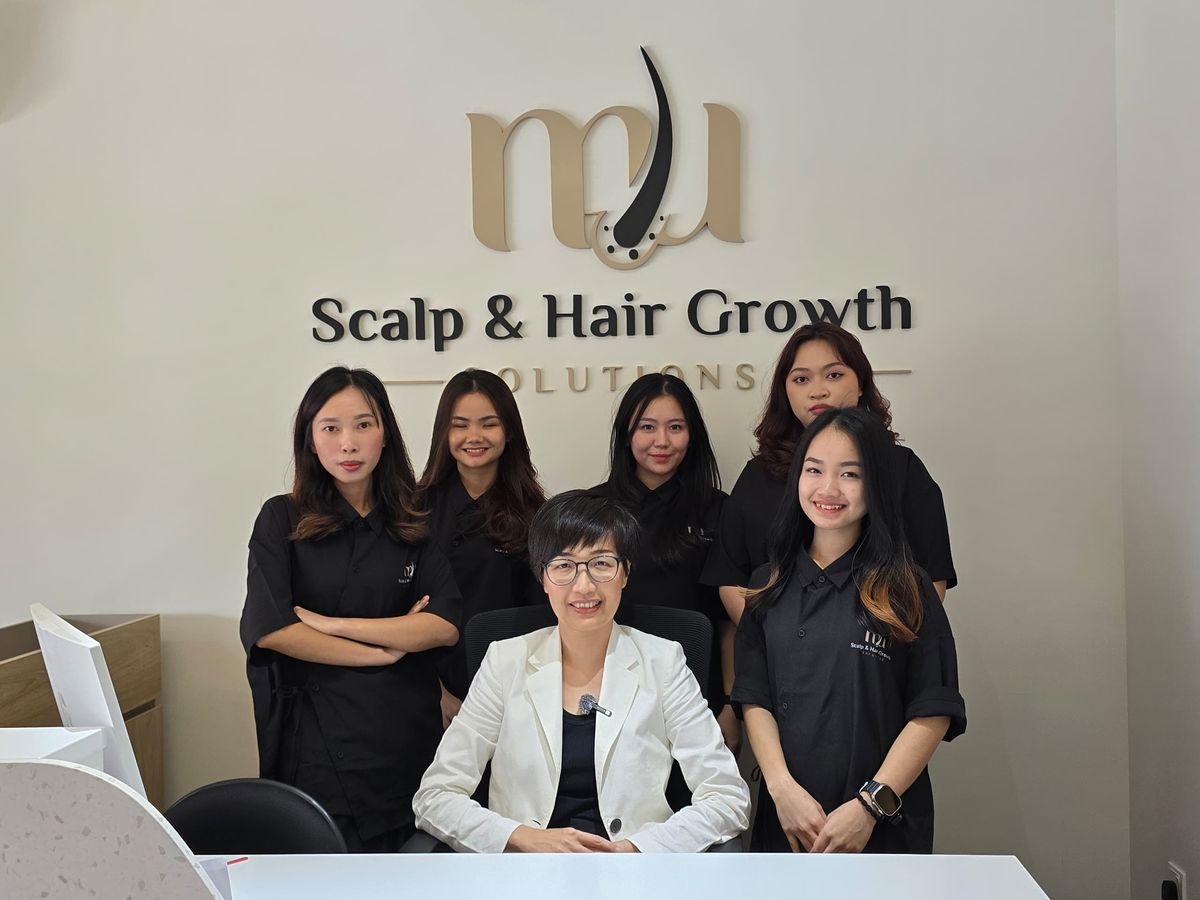 MU Scalp team at reception — Dr. Lu and staff